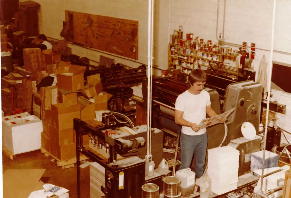 John Hewitt, Sr. checking a press sheet on the Graph-Pak floor in the early 1980s